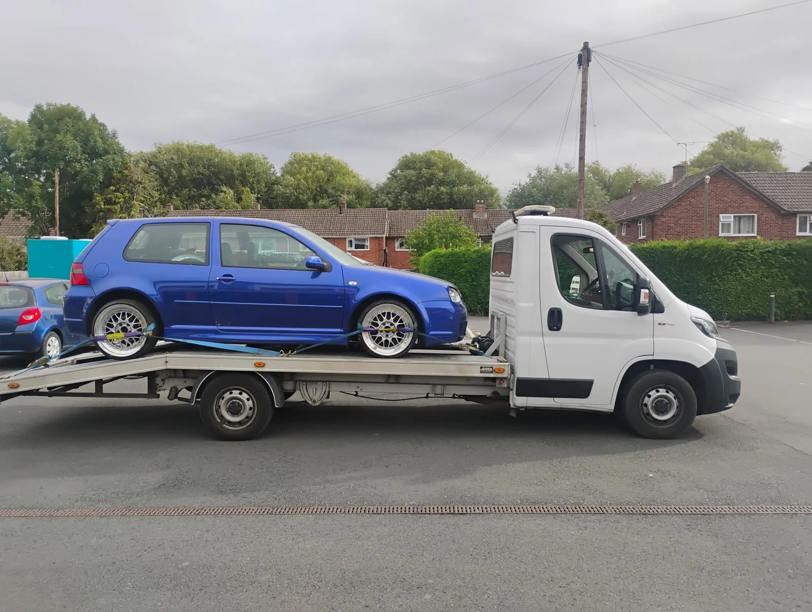 Blue VW Golf R32 loaded on Ian's transporter in Hereford, bound for secure storage in Bartestree