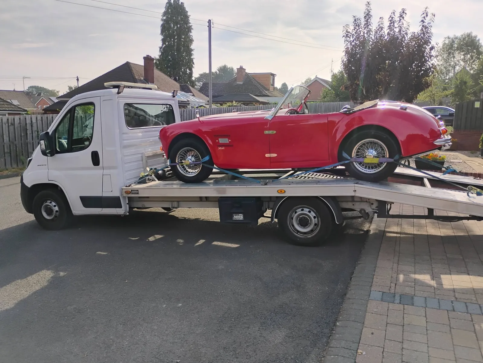 Red Allard with wire wheels strapped onto Ian's transporter in Hereford, bound for H&H Classic Auctions in Surrey
